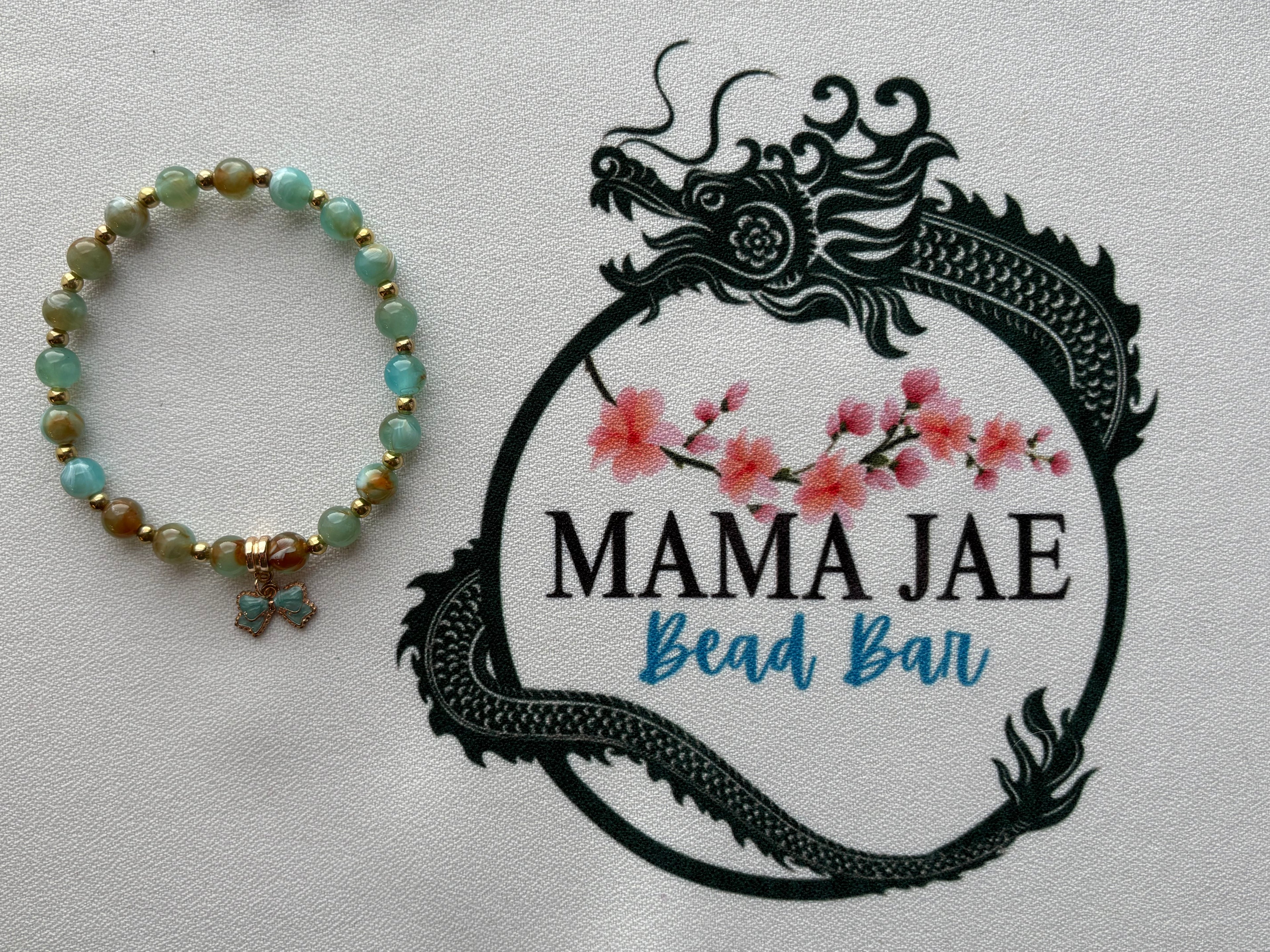 Green Jade Beaded Bracelet with Gold Accents & Bow Charm